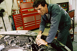 Second mechanic working on car