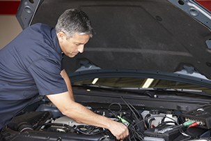 Mechanic working on car